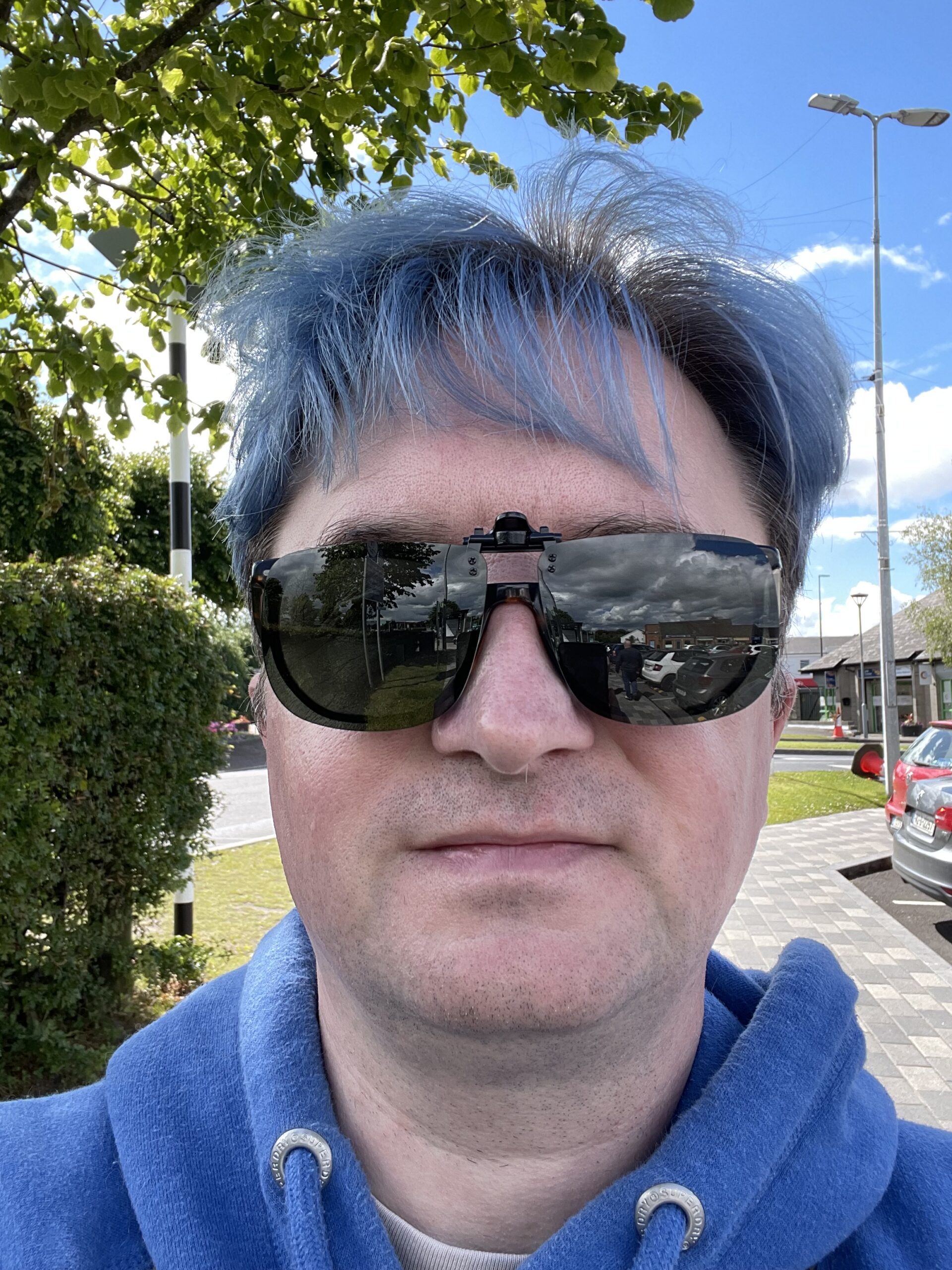 I'm wearing large clip-on sunglasses on a very sunny day